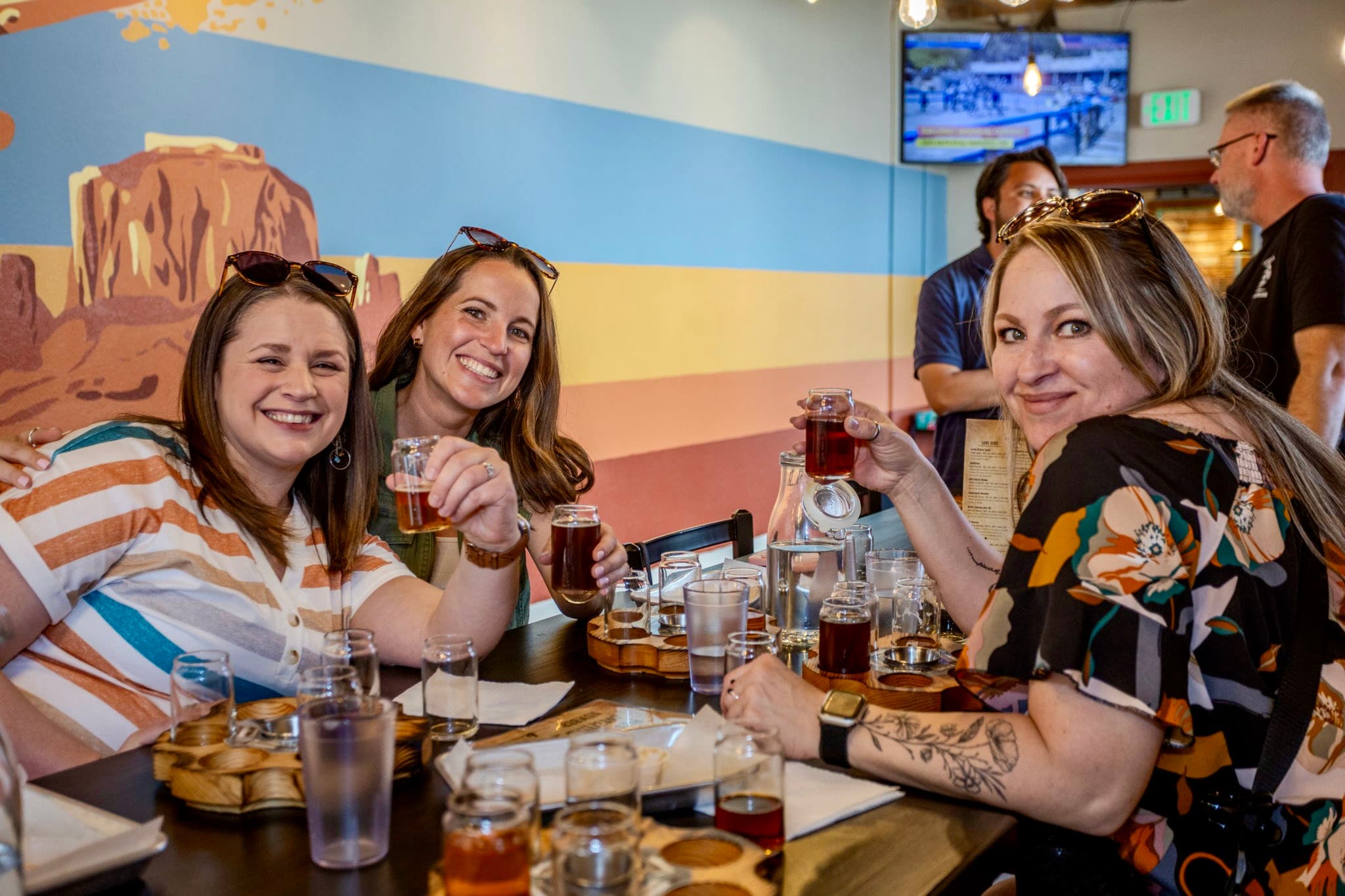 Friends sharing tastings on a Colorado Springs food tour