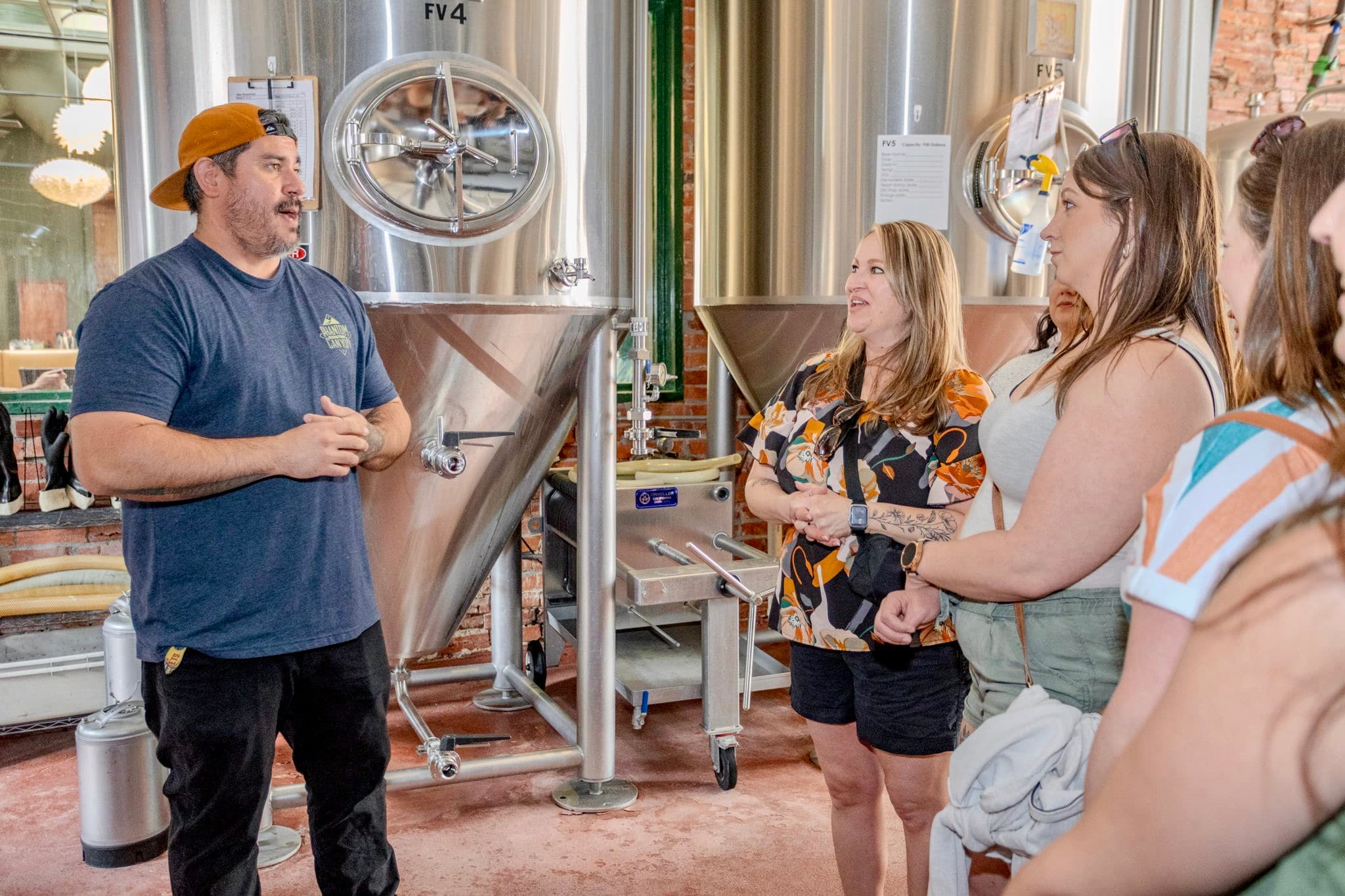 Bachelorette group toasting at the end of a Colorado Springs food tour