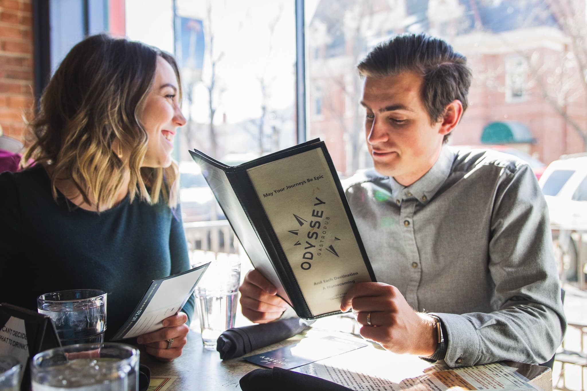 Couple smiling at a Colorado Springs restaurant