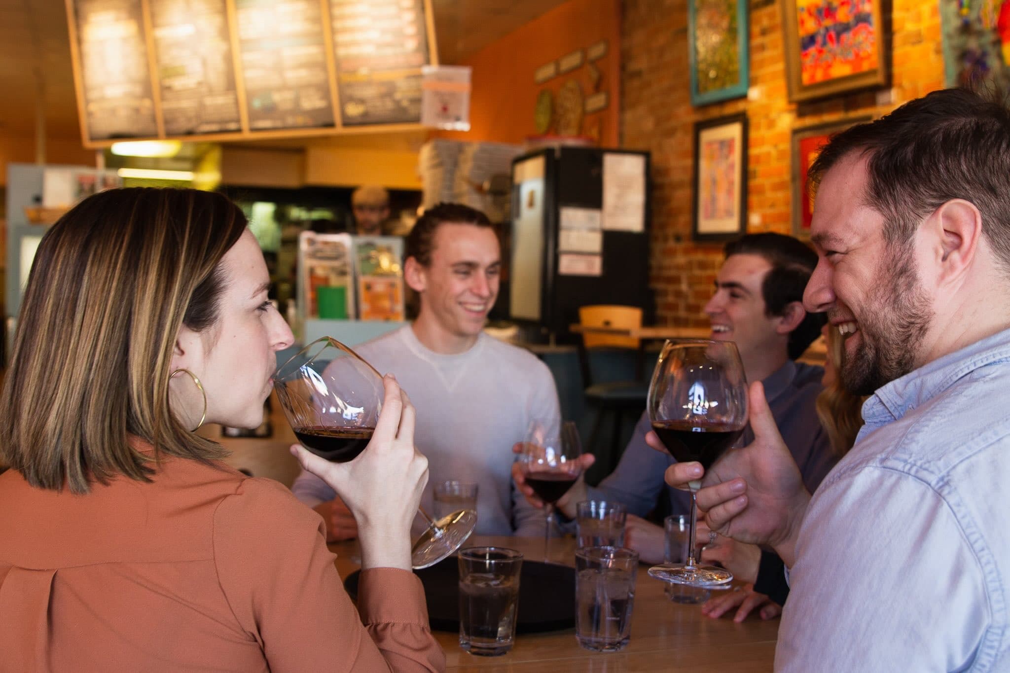 Couple toasting wine on a Colorado Springs food tour