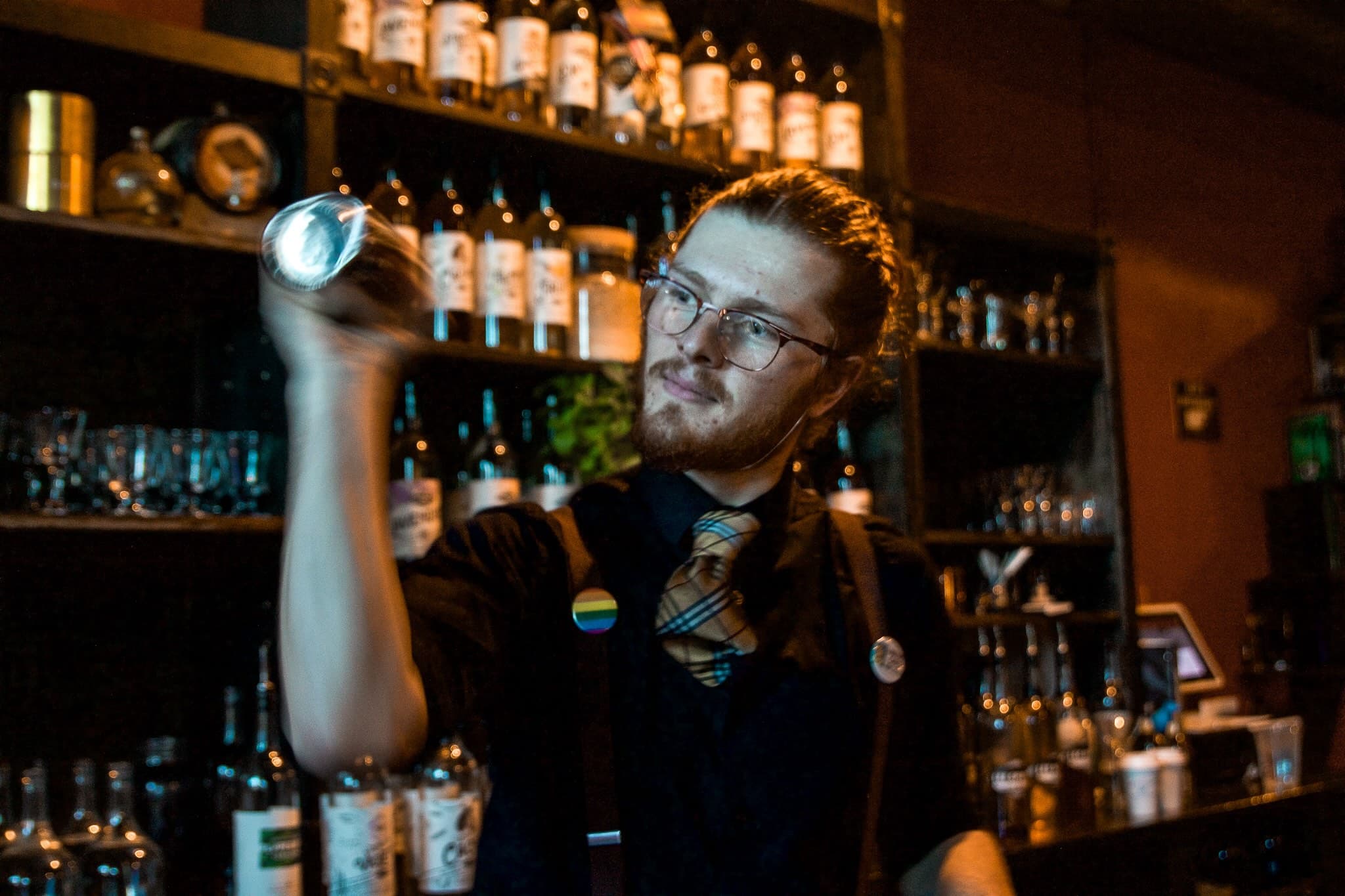 Bartender mixing a craft cocktail for a corporate group