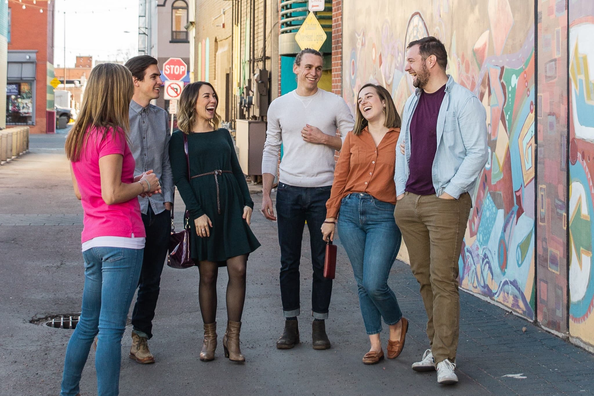 Corporate group laughing during a downtown Colorado Springs food tour