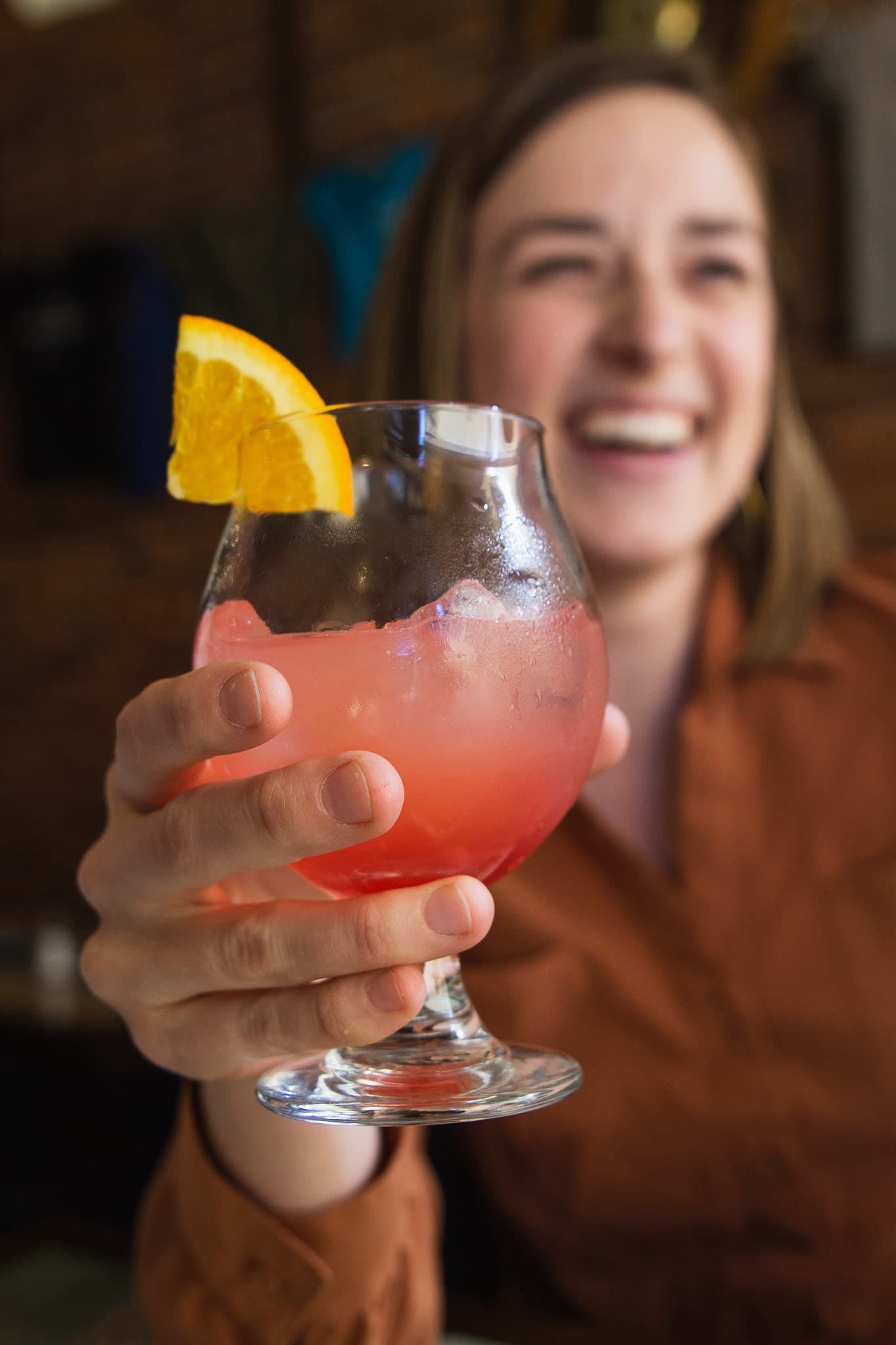 Craft cocktail in focus on a corporate Colorado Springs food tour