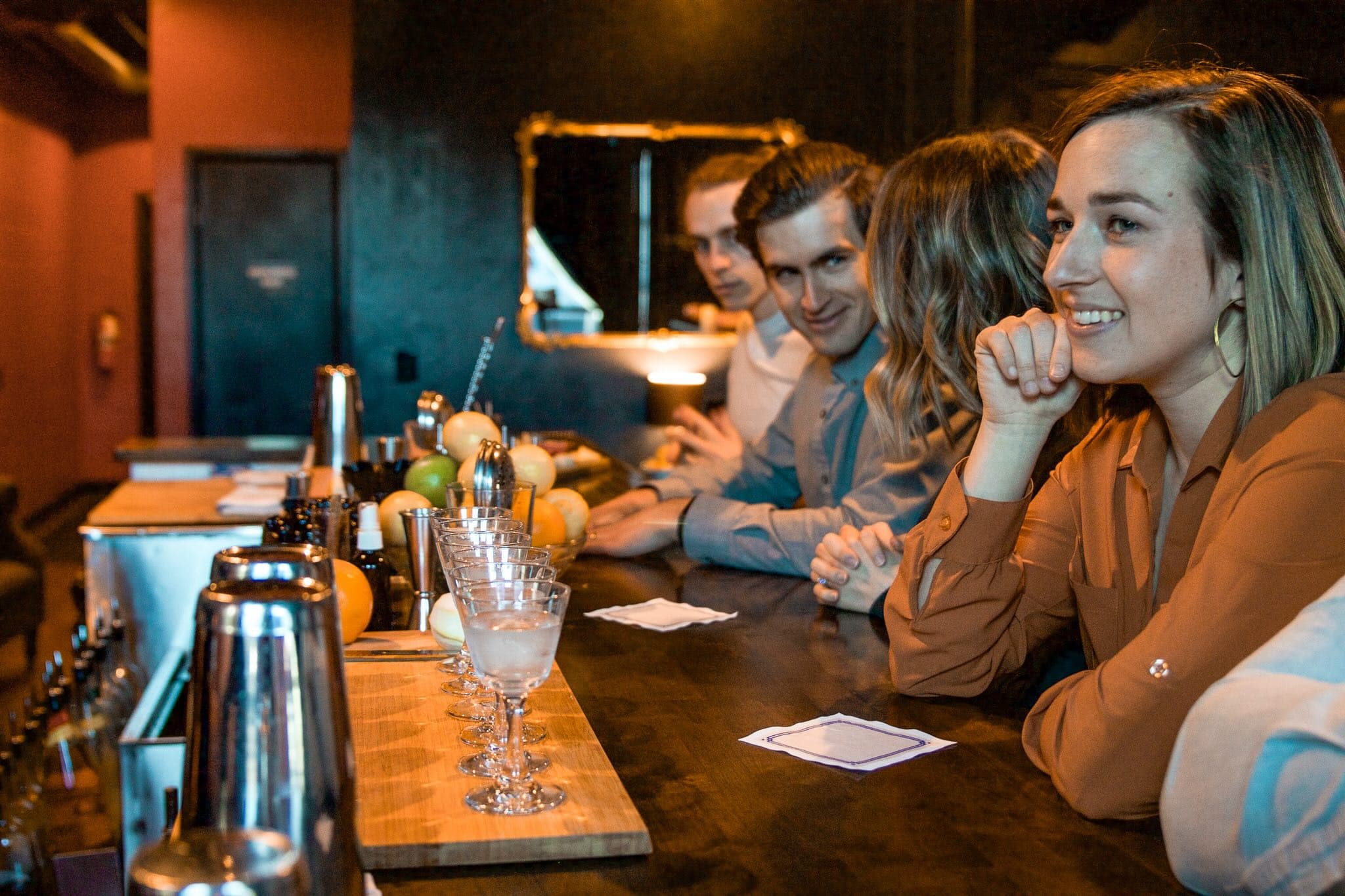 Corporate group seated at a bar enjoying a Rocky Mountain Food Tour in Colorado Springs