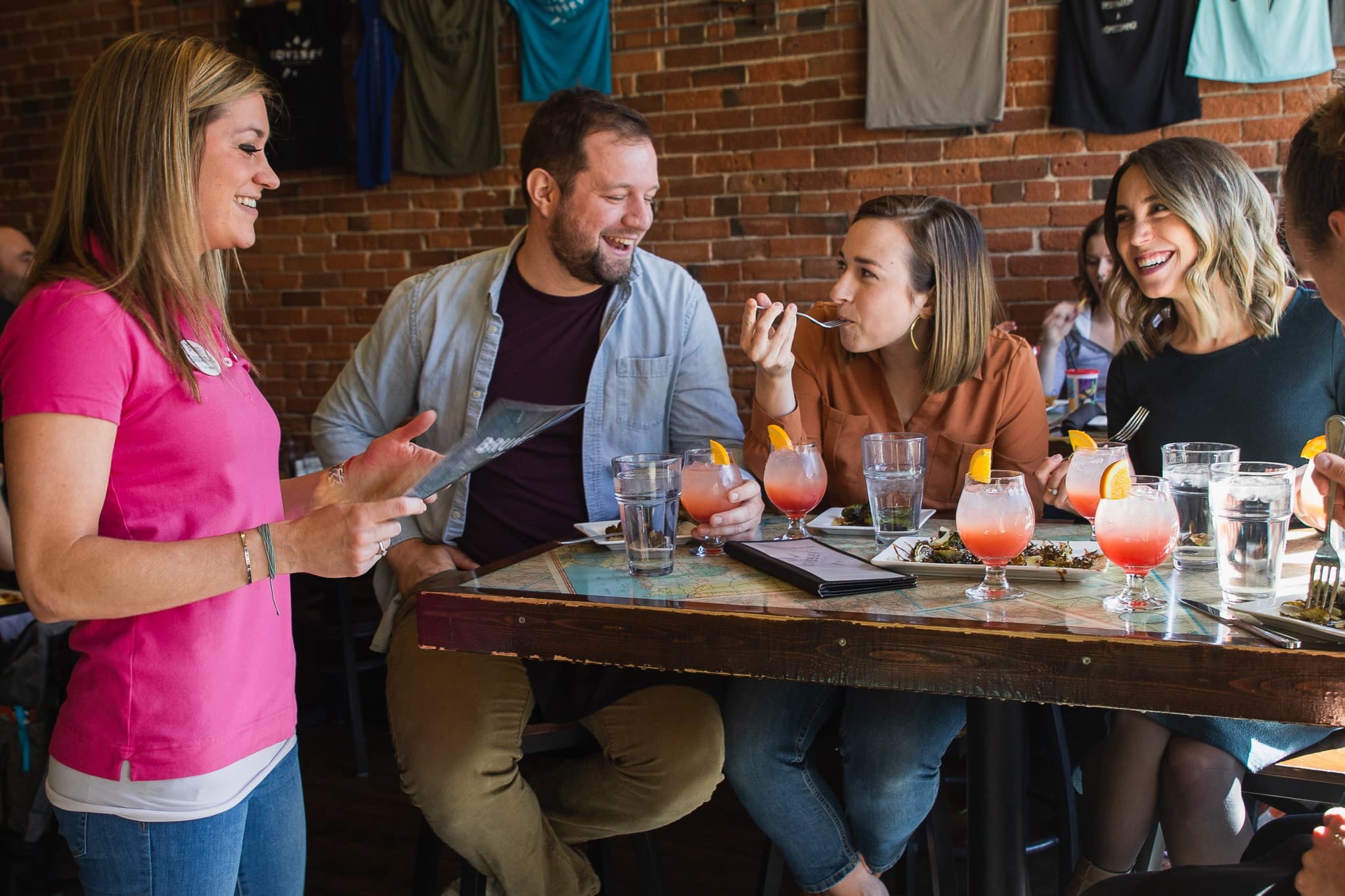 Rocky Mountain Food Tours guests toasting on a Colorado Springs food tour