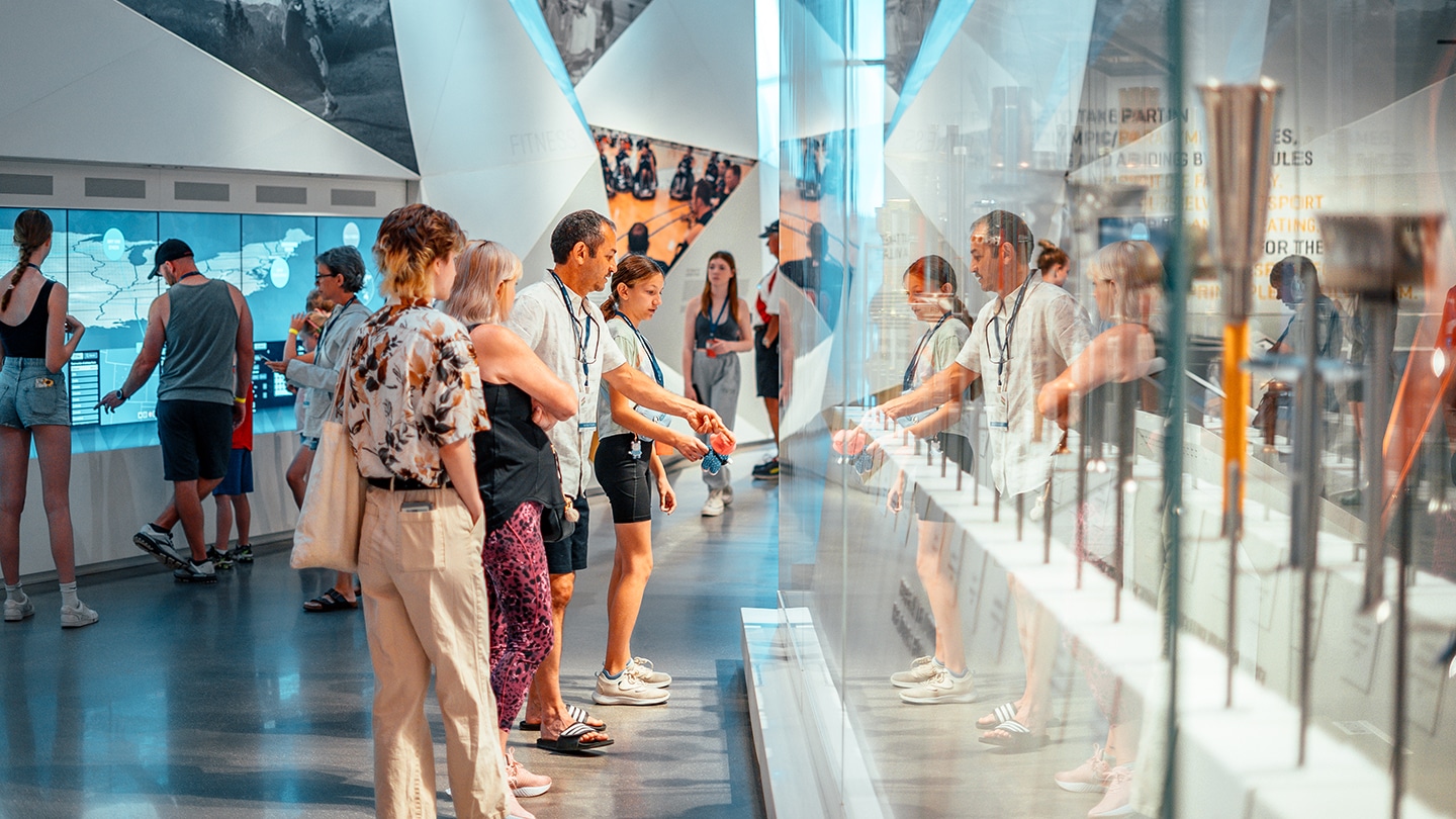 Group looking at medals at the US Olympic + Paralympic Museum. 