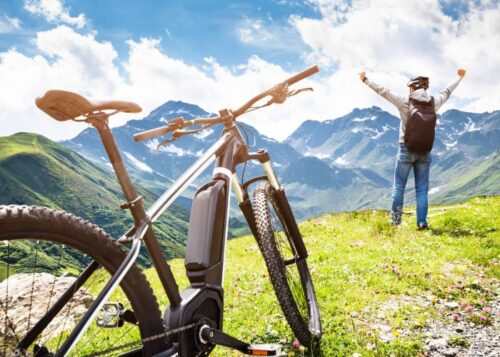 Person celebrating on mountain e-bike in Manitou Springs