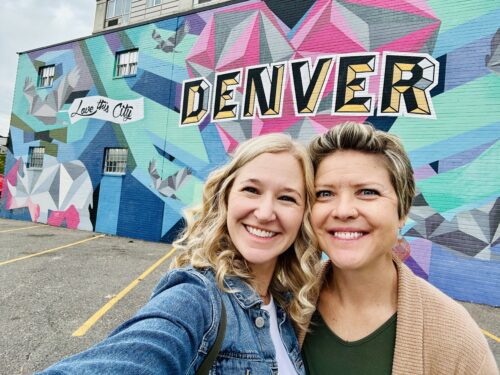 Denver Graffiti Tour | Two Women in front of a Denver Mural