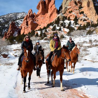 Horseback Riding through Garden of the Gods - Group on Horses with snow