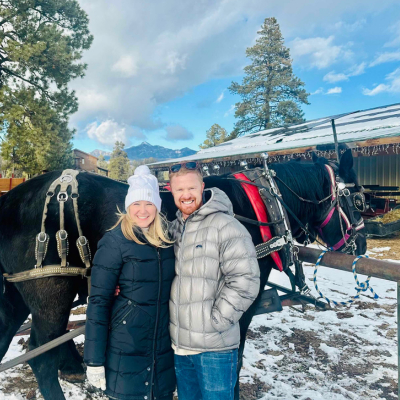 Pagosa Springs Horse-Drawn Wagon and Sleigh Ride | Couple Standing in front of Horses