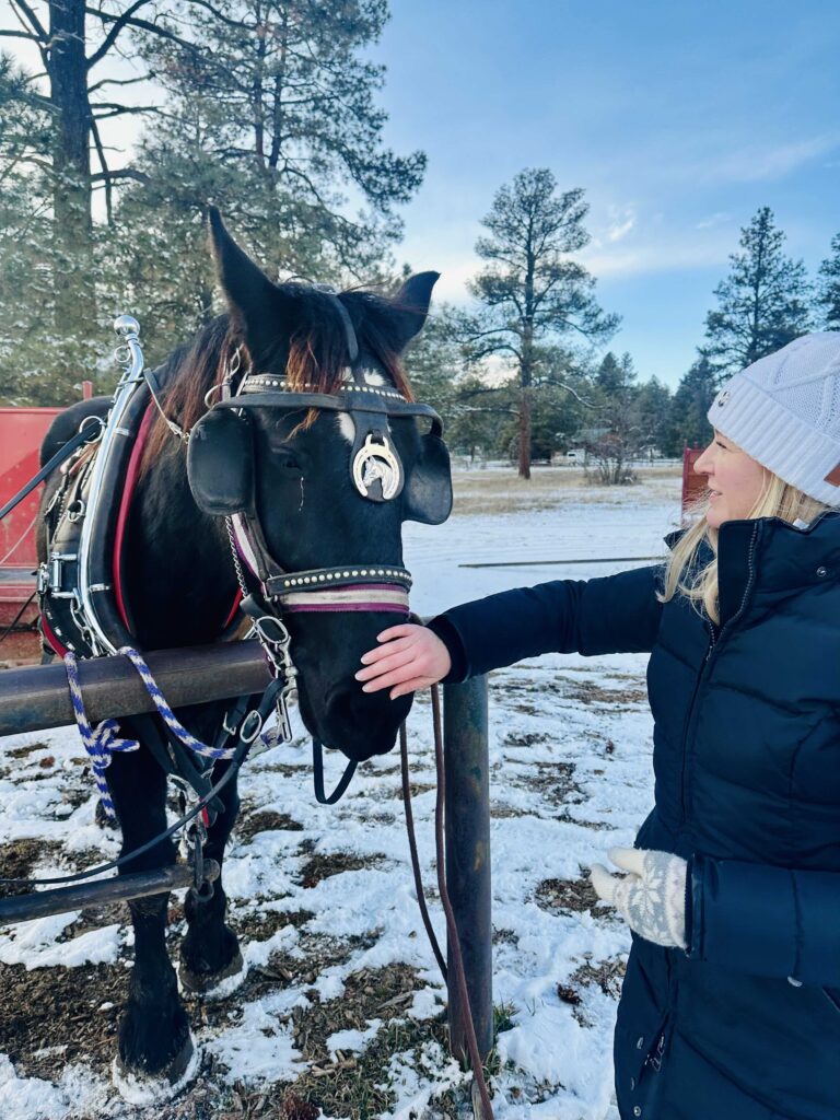 Samantha Feeding Horse in Pagosa Springs